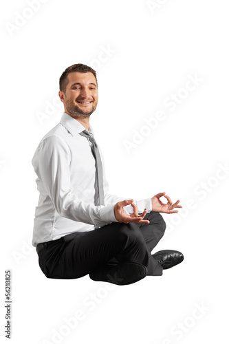 Photo: smiley businessman practicing yoga smiley businessman practicing yoga