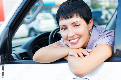 Photo: Smiling senior woman in a car Smiling senior woman in a car