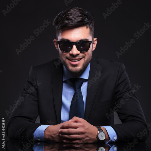 Photo: young business man smiles at you young business man smiles at you