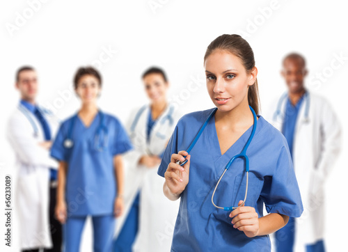 Photo: Nurse in front of her medical team Nurse in front of her medical team