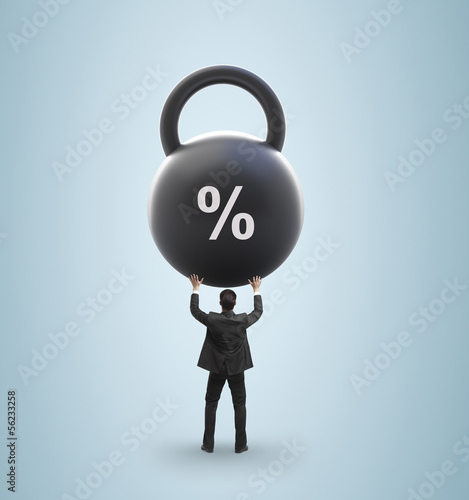 Photo: man holding weight man holding weight
