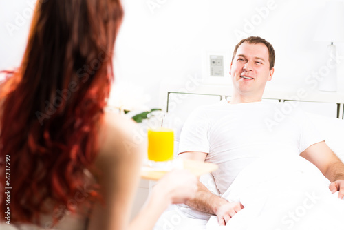 Photo: woman brought her boyfriend breakfast in bed woman brought her boyfriend breakfast in bed
