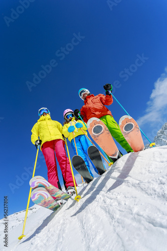Photo: Skiing, skiers, sun and fun - family enjoying winter Skiing, skiers, sun and fun - family enjoying winter