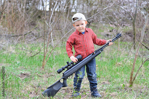 Photo: Little boy with a rifle Little boy with a rifle