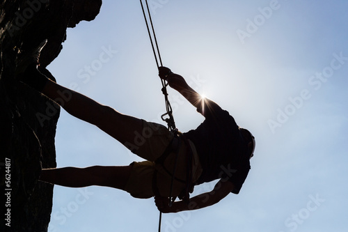 Photo: Silhouetted Man Climbing Rock Silhouetted Man Climbing Rock