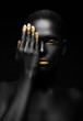 dark-skinned woman with golden make-up. dark-skinned woman with golden make-up.