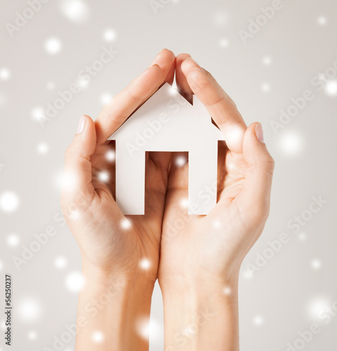 Photo: woman hands holding paper house woman hands holding paper house