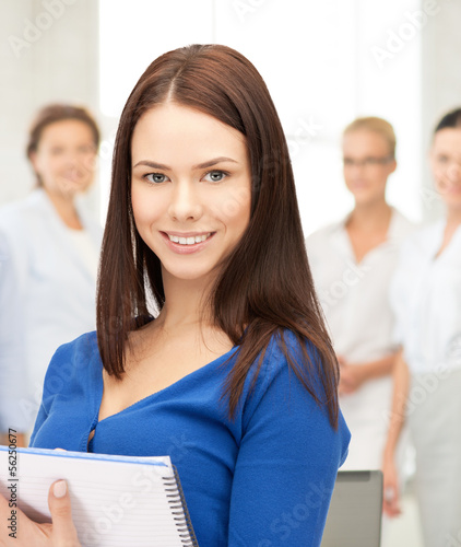 Photo: happy woman with big notepad happy woman with big notepad