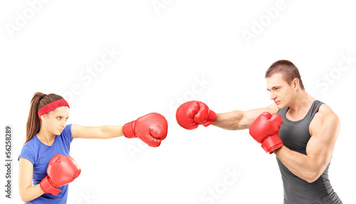 Photo: Female and male boxers with boxing gloves during a match Female and male boxers with boxing gloves during a match