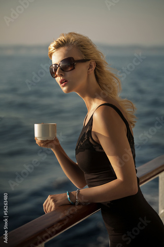 Photo: Picture of surprised lady with cup of coffee Picture of surprised lady with cup of coffee