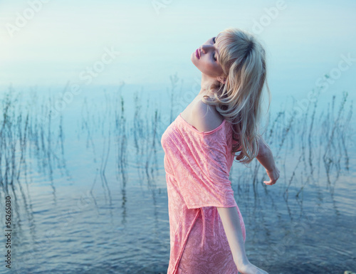 Photo: Sensual blonde girl enjoying cold lake water Sensual blonde girl enjoying cold lake water
