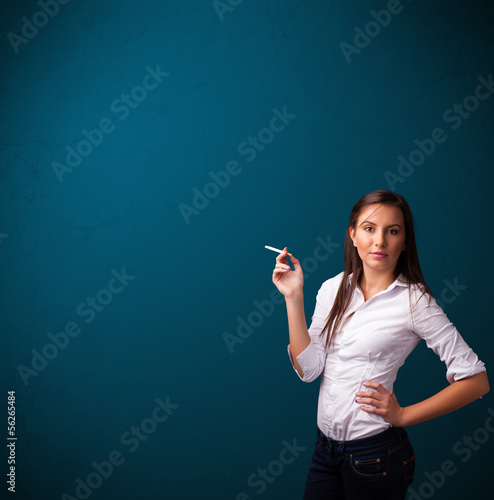 Photo: Beautiful woman smoking cigarette vith copy space Beautiful woman smoking cigarette vith copy space
