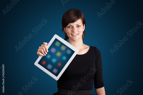 Photo: woman holding modern tablet with colorful icons woman holding modern tablet with colorful icons