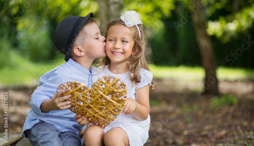 Photo: Great portrait of two kissing kids Great portrait of two kissing kids