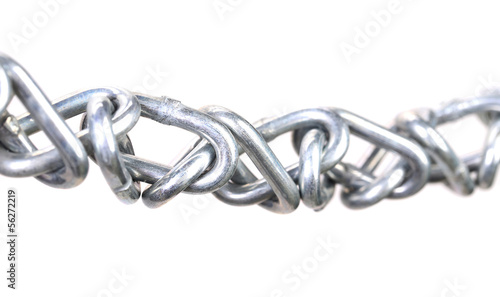 Photo: Twisted chain. Isolated on a white background. Twisted chain. Isolated on a white background.