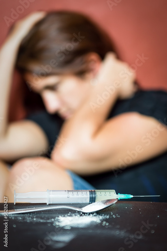 Photo: Syringe, drugs and desperate female drug addict Syringe, drugs and desperate female drug addict