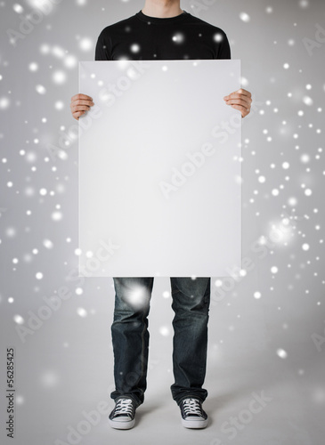 Photo: man showing white blank board man showing white blank board