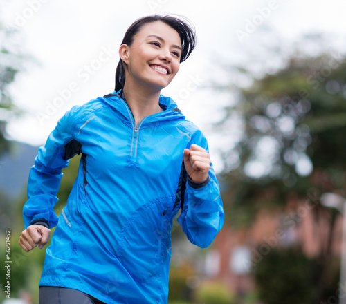 Photo: Woman running outdoors Woman running outdoors