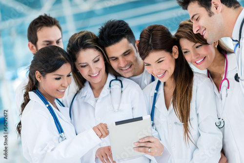 Photo: Doctors using health app on a tablet Doctors using health app on a tablet
