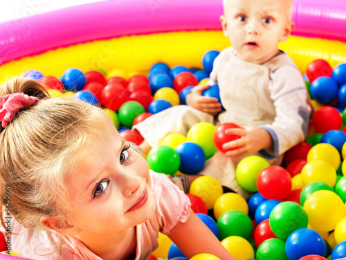 Photo: Child in colored ball. Child in colored ball.