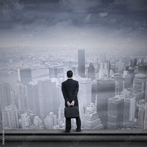 Photo: Asian businessman looking into the future Asian businessman looking into the future