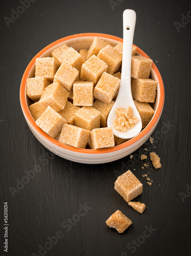 Photo: Brown sugar cubes in a ceramic dish Brown sugar cubes in a ceramic dish