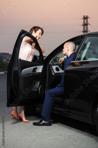 Photo: Happy young couple at the car Happy young couple at the car