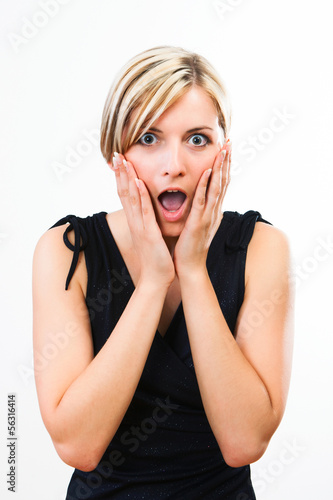 Photo: Beautiful young woman showing her surprise Beautiful young woman showing her surprise