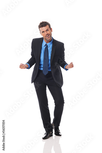 Photo: Handsome business man gesturing success sign Handsome business man gesturing success sign