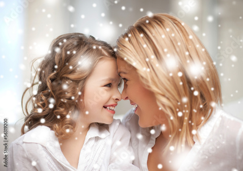 Photo: mother and daughter cuddling mother and daughter cuddling