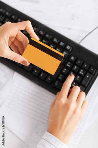 Photo: businesswoman with laptop using credit card businesswoman with laptop using credit card