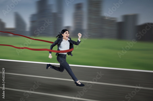 Photo: Asian businesswoman winning the race Asian businesswoman winning the race