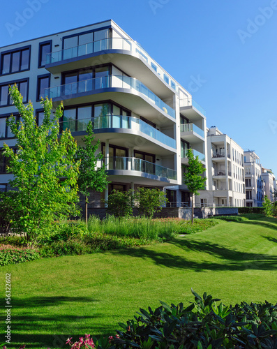 Photo: Apartment houses and green grass Apartment houses and green grass