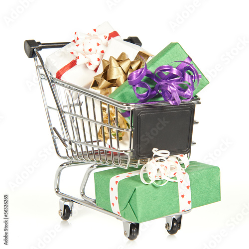 Photo: Shopping cart filled with christmas gifts Shopping cart filled with christmas gifts