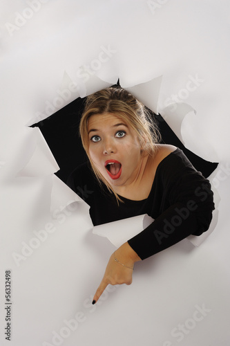 Photo: Beautiful belonde girl behind the hold point out Beautiful belonde girl behind the hold point out