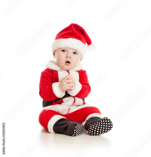 Photo: funny baby in Santa Claus clothes funny baby in Santa Claus clothes