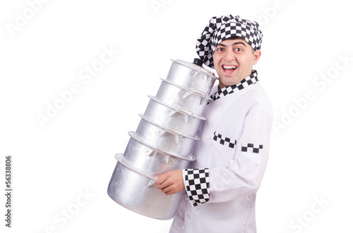 Photo: Cook with stack of pots on white Cook with stack of pots on white