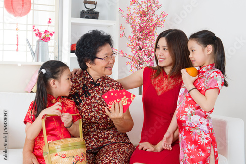 Photo: Asian family celebrate Chinese new year at home. Asian family celebrate Chinese new year at home.