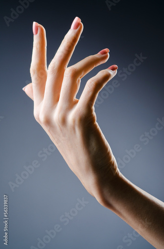 Photo: Woman hands against gradient background Woman hands against gradient background