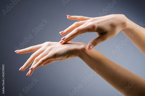 Photo: Woman hands against gradient background Woman hands against gradient background