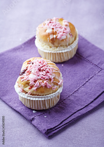 Photo: Two muffins with icing sugar Two muffins with icing sugar