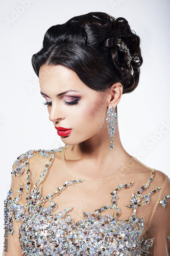 Photo: Formal Party. Fashion Model in Formal Shiny Dress with Jewels Formal Party. Fashion Model in Formal Shiny Dress with Jewels
