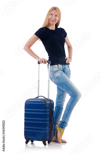 Photo: Woman preparing for vacation on white Woman preparing for vacation on white