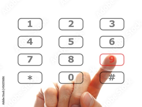 Photo: finger push a telephone number button finger push a telephone number button