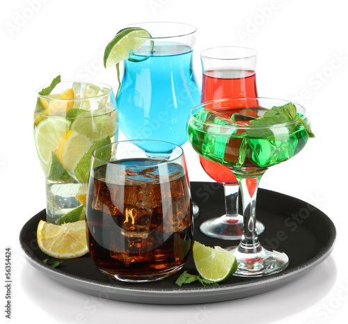 Photo: Many glasses of cocktails on tray, isolated on white Many glasses of cocktails on tray, isolated on white