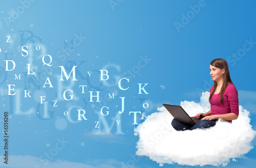 Photo: Young woman sitting in cloud with laptop Young woman sitting in cloud with laptop