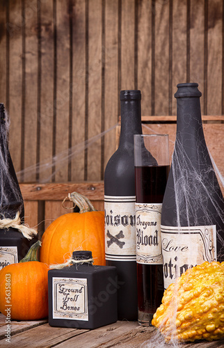 Photo: Potion bottles with pumpkins Potion bottles with pumpkins