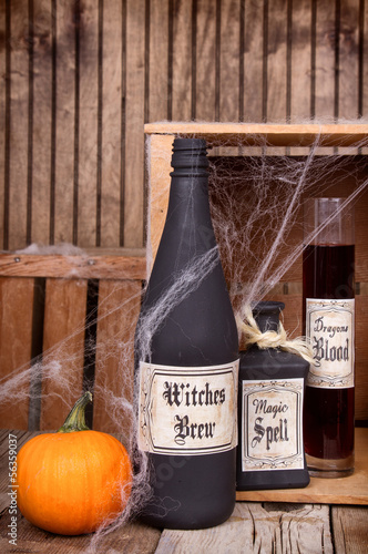 Photo: Potion bottles with pumpkins Potion bottles with pumpkins