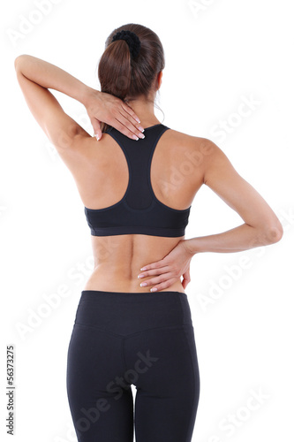 Photo: Back pain in young girls isolated on white Back pain in young girls isolated on white