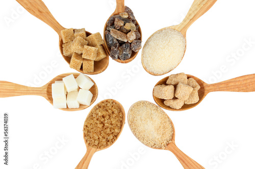 Photo: Different types of sugar in spoons isolated on white Different types of sugar in spoons isolated on white